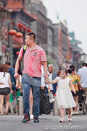 Chinese man with child, Beijing, China Editorial Stock Photo